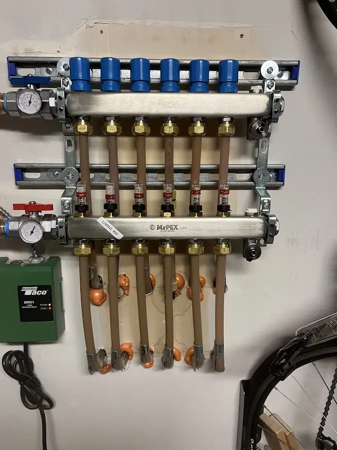 Plumber performing Water Heater Repair at a residential property in Tupelo